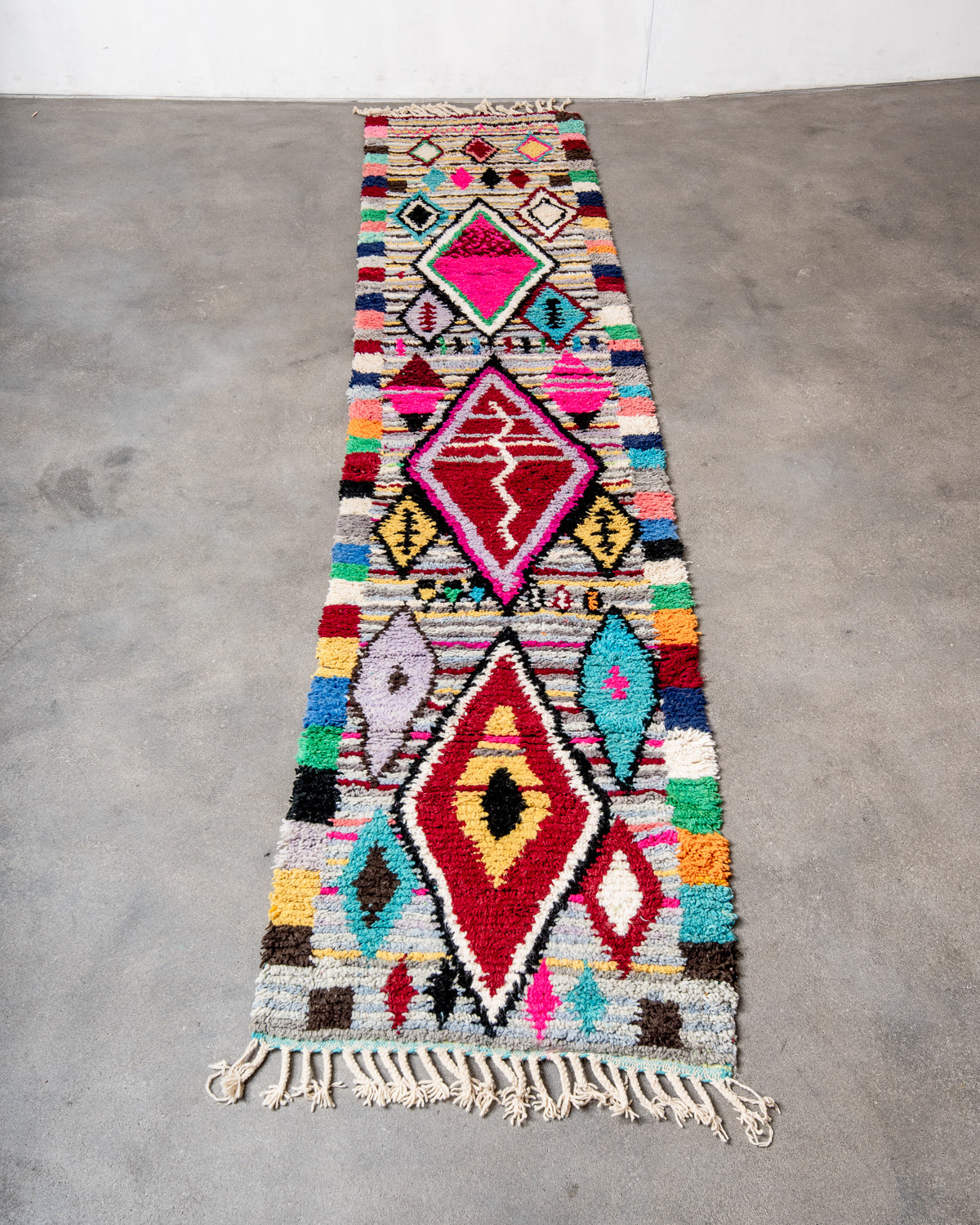Modern, designer, handcrafted Berber runner rug from Morocco. Beniourain carpet with beautiful colours and patterns and fluffy wool texture.